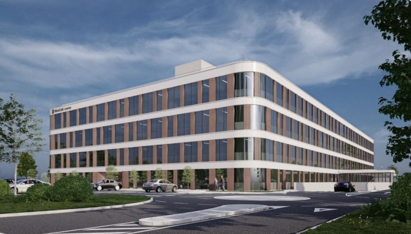 Außenansicht des modernen Bürogebäudes YOUR OFFICE Campus Noricum mit geschwungener Architektur und Parkplatz