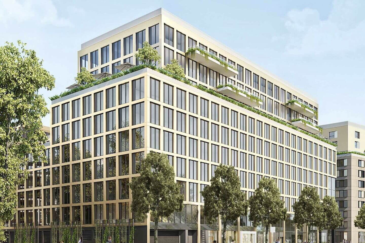 Exterior architectural view of a modern multi-story commercial building with large windows and rooftop greenery.