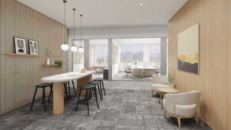 Moderne Büro-Lounge mit Holz-Wandverkleidung, Stehtisch und gemütlichen Sitzmöbeln im Campus Noricum von YOUR OFFICE