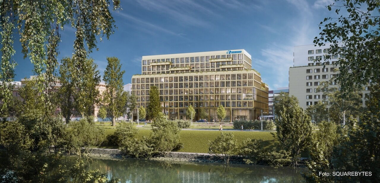 Architectural rendering of the Leopoldsquartier Block A office building viewed across a river with surrounding greenery and trees