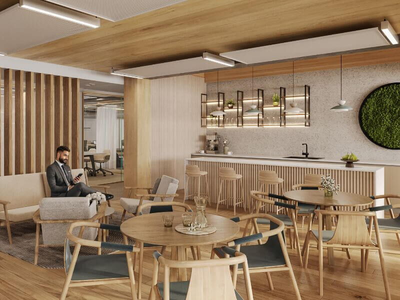 Contemporary office interior with wooden paneling, comfortable seating, and a kitchenette at Leopoldsquartier